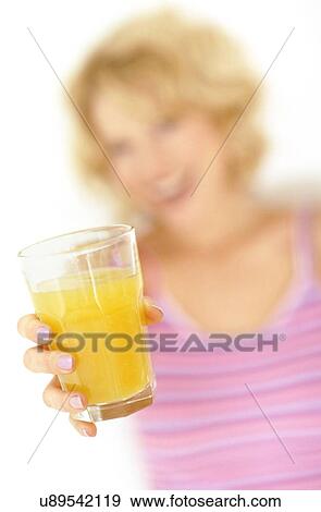 Woman with orange juice View Large Photo Image Stock Photo - Woman with orange juice. Fotosearch
