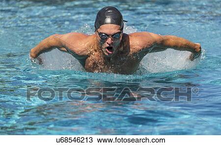 Stock Image - Athletic man swimming. Fotosearch