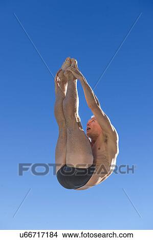 Picture - Athletic swimmer jumping. Fotosearch