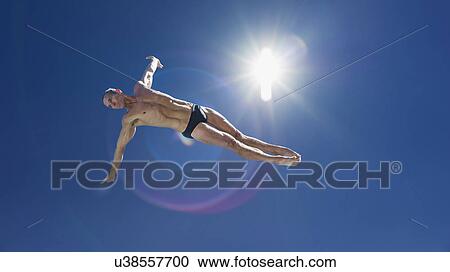 Athletic swimmer jumping View Large Photo Image Stock Image - Athletic swimmer jumping. Fotosearch