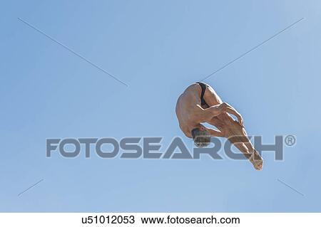Athletic swimmer jumping View Large Photo Image Stock Image - Athletic swimmer jumping. Fotosearch