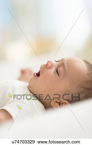 Baby boy (2-5 months) yawing View Large Photo Image Stock Photo - Baby boy (2-5 months) yawing. Fotosearch
