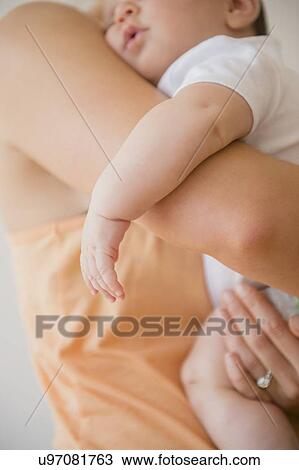 Baby girl (2-5 months) being embraced by mother View Large Photo Image Stock Image - Baby girl (2-5 months) being embraced by mother. Fotosearch