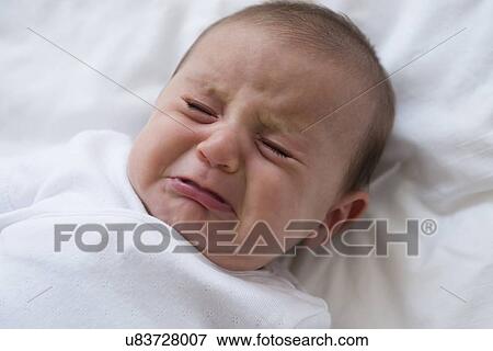 Stock Photo - Baby girl (2-5 months) crying. Fotosearch