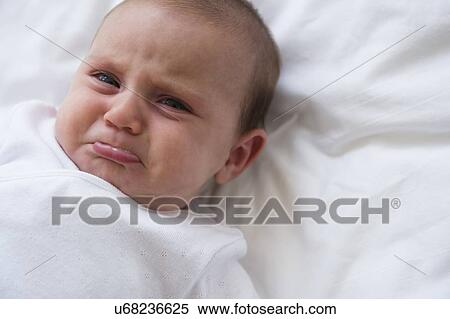 Stock Photography - Baby girl (2-5 months) crying. Fotosearch