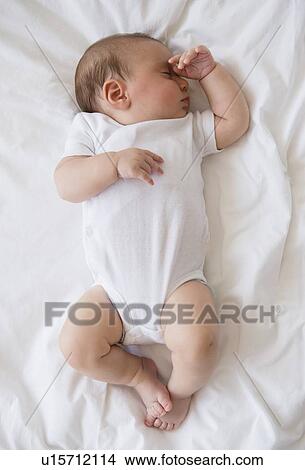 Baby girl (2-5 months) sleeping in bed View Large Photo Image Picture - Baby girl (2-5 months) sleeping in bed. Fotosearch