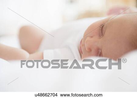 Baby girl (2-5 months) sleeping in bed View Large Photo Image Picture - Baby girl (2-5 months) sleeping in bed. Fotosearch