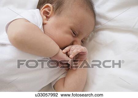 Baby girl (2-5 months) sleeping in bed View Large Photo Image Stock Image - Baby girl (2-5 months) sleeping in bed. Fotosearch