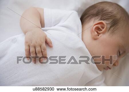 Baby girl (2-5 months) sleeping in bed View Large Photo Image Stock Image - Baby girl (2-5 months) sleeping in bed. Fotosearch