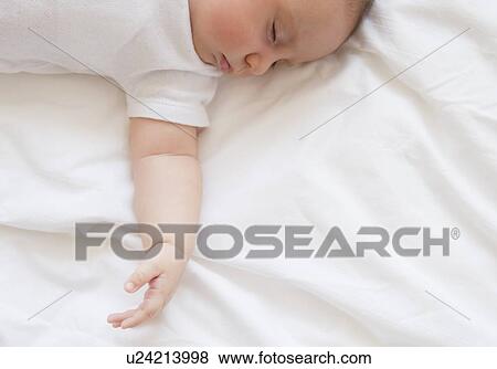 Baby girl (2-5 months) sleeping in bed View Large Photo Image Stock Photo - Baby girl (2-5 months) sleeping in bed. Fotosearch