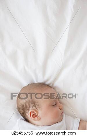 Baby girl (2-5 months) sleeping in bed View Large Photo Image Stock Photograph - Baby girl (2-5 months) sleeping in bed. Fotosearch