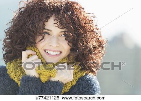 Stock Photograph - Beautiful brunette woman outdoors. Fotosearch