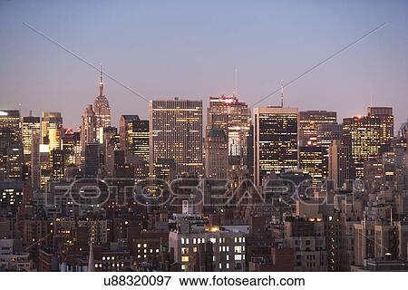 Stock Photo - City skyline at dusk. Fotosearch