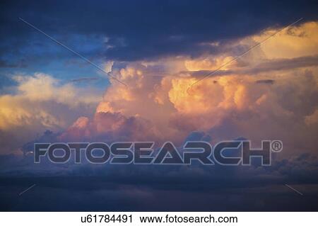 Stock Image - Clouds on blue sky. Fotosearch