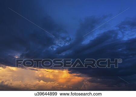 Stock Photo - Clouds on blue sky. Fotosearch