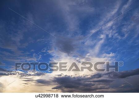 Clouds on blue sky View Large Photo Image Stock Photo - Clouds on blue sky. Fotosearch