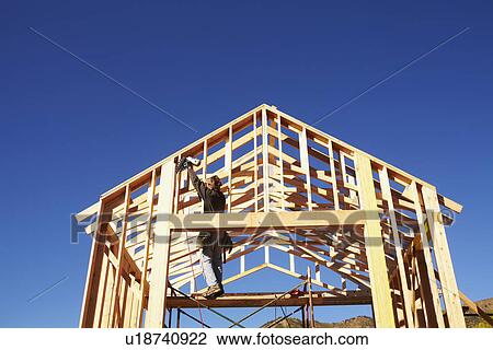 Construction worker working on construction site View Large Photo Image Stock Image - Construction worker working on construction site. Fotosearch