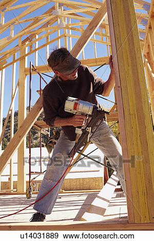 Construction worker working on construction site View Large Photo Image Stock Photo - Construction worker working on construction site. Fotosearch
