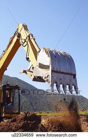 Stock Photo - Construction worker working on construction site. Fotosearch