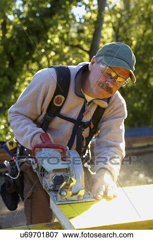Stock Photo - Construction worker working on construction site. Fotosearch