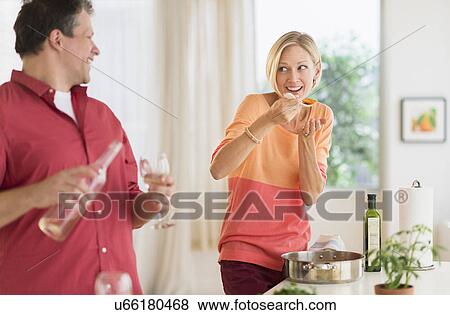 Couple cooking at home View Large Photo Image Stock Photo - Couple cooking at home. Fotosearch