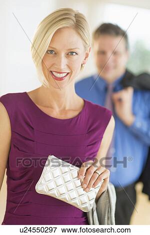 Stock Photo - Couple in evening wear, focus on woman. Fotosearch