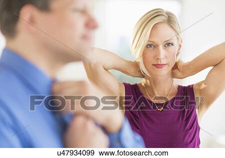 Couple in evening wear, focus on woman View Large Photo Image Stock Photo - Couple in evening wear, focus on woman. Fotosearch