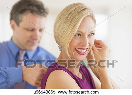 Couple in evening wear, focus on woman View Large Photo Image Stock Photography - Couple in evening wear, focus on woman. Fotosearch
