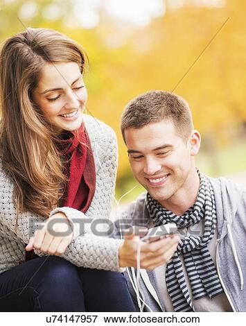 Stock Photo - Couple listening to music in Central Park. Fotosearch