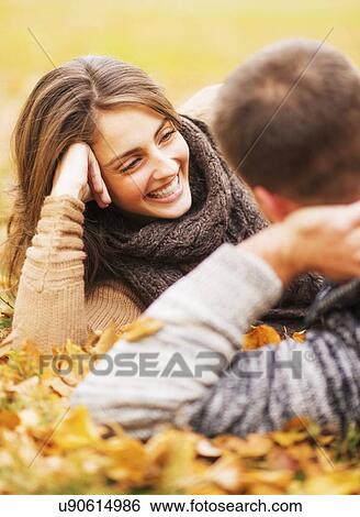 Stock Photograph - Couple lying down in Central Park. Fotosearch