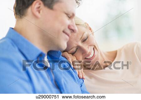 Couple relaxing, focus on woman View Large Photo Image Stock Image - Couple relaxing, focus on woman. Fotosearch