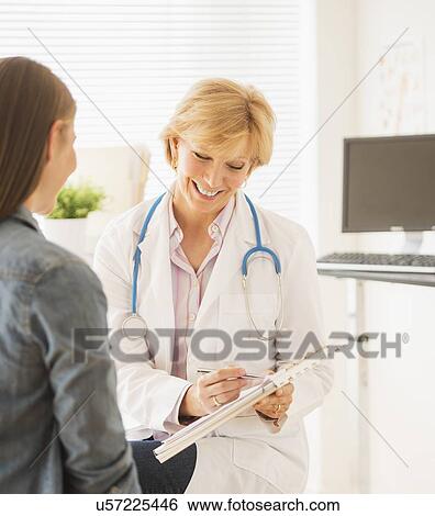 Stock Photograph - Doctor and patient talking. Fotosearch