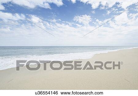 Stock Photograph - Empty sandy beach. Fotosearch
