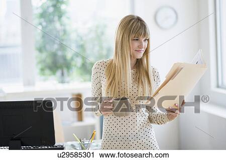 Female designer working in office View Large Photo Image Stock Image - Female designer working in office. Fotosearch