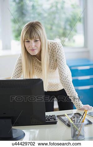 Female designer working on computer View Large Photo Image Stock Image - Female designer working on computer. Fotosearch