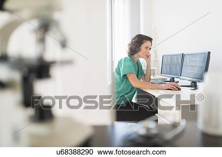 Female technician working on computer View Large Photo Image Stock Image - Female technician working on computer. Fotosearch