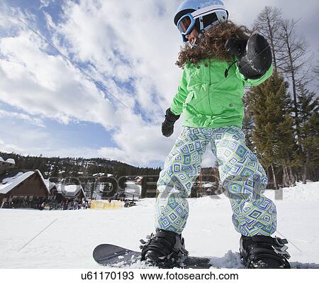 Girl on snowboard View Large Photo Image Stock Image - Girl on snowboard. Fotosearch