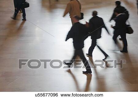 Stock Photograph - High angle view of people walking at Grand Central Station. Fotosearch