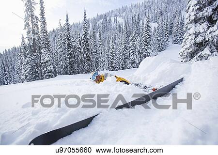 Male skier lying on snow View Large Photo Image Stock Image - Male skier lying on snow. Fotosearch
