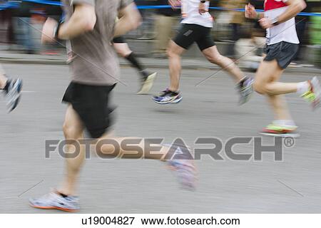 Marathon runners in action View Large Photo Image Stock Photo - Marathon runners in action. Fotosearch