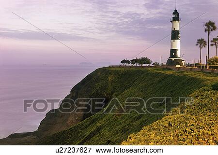Stock Photo - Miraflores, Lighthouse at sunset. Fotosearch