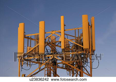 Mobile phone tower on evening sky View Large Photo Image Stock Image - Mobile phone tower on evening sky. Fotosearch