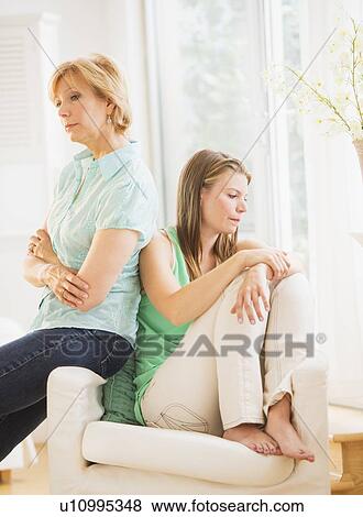 Mother and adult daughter back to back View Large Photo Image Stock Photo - Mother and adult daughter back to back. Fotosearch