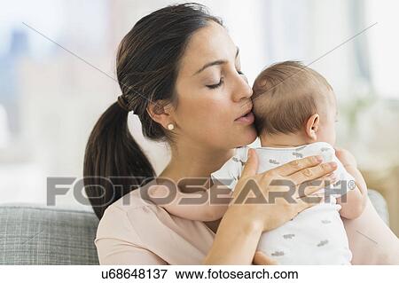 Mother embracing baby boy (2-5 months) View Large Photo Image Stock Photo - Mother embracing baby boy (2-5 months) . Fotosearch