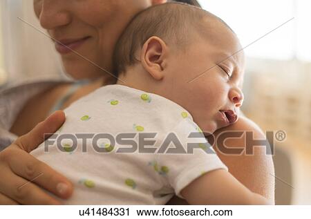 Mother holding baby (2-5 months) View Large Photo Image Stock Image - Mother holding baby (2-5 months). Fotosearch