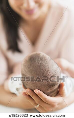 Mother holding baby boy (2-5 months) View Large Photo Image Stock Image - Mother holding baby boy (2-5 months) . Fotosearch