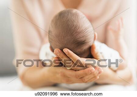 Mother holding baby boy (2-5 months) View Large Photo Image Stock Photograph - Mother holding baby boy (2-5 months) . Fotosearch