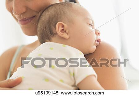 Mother holding baby boy (2-5 months) View Large Photo Image Stock Photography - Mother holding baby boy (2-5 months). Fotosearch