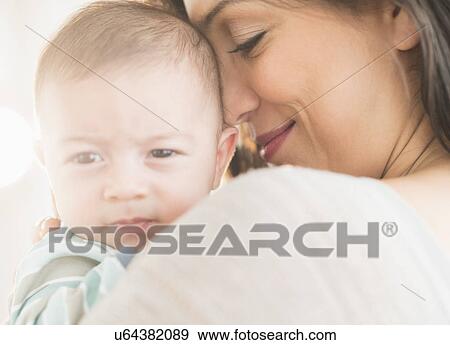 Stock Photo - Mother with baby (2-5 months). Fotosearch