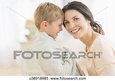 Mother with son (6-7) wrapped in towel View Large Photo Image Stock Photography - Mother with son (6-7) wrapped in towel. Fotosearch